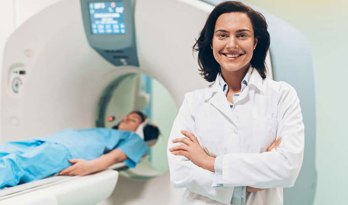 Female doctor and a patient with MRI scanner